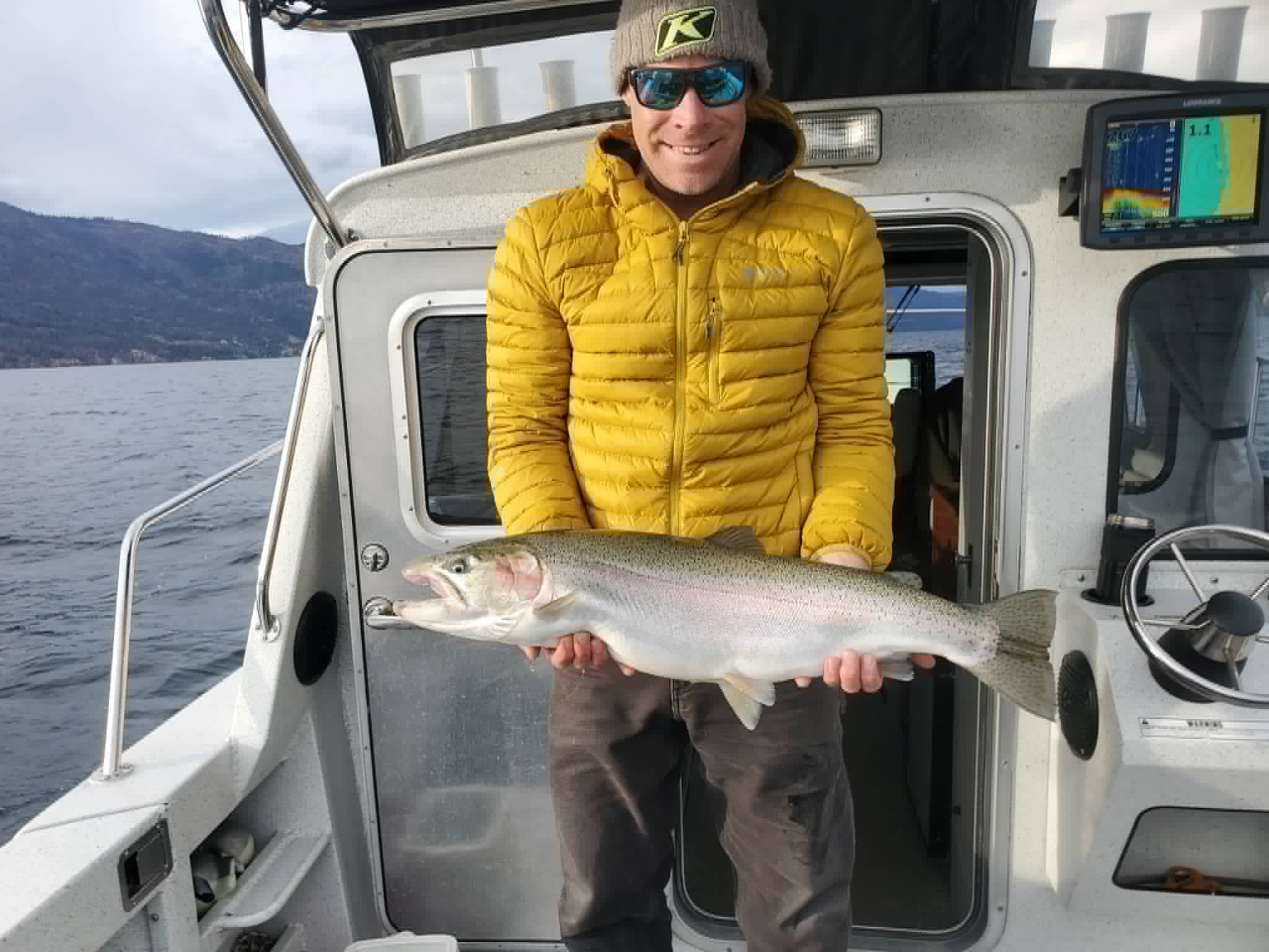 Captain Dennis Barnes with a trophy rainbow trout